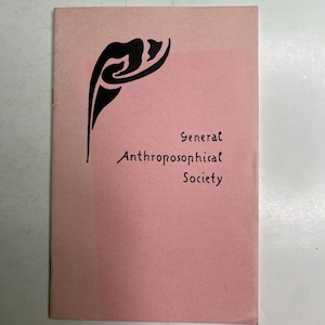 May include: A rectangular pamphlet with a light pink cover featuring a black abstract graphic design in the upper left corner. The text General Anthroposophical Society is printed in black ink on the right side of the cover in a stylized font.