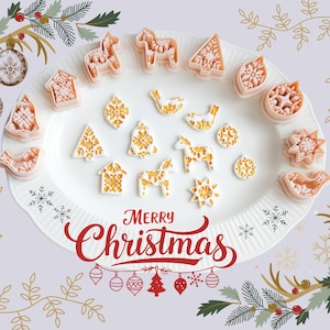 May include: A set of three ceramic mugs with a speckled, matte finish. The mugs are in shades of cream, light gray, and dark gray. Each mug has a simple, minimalist design, perfect for coffee or tea.