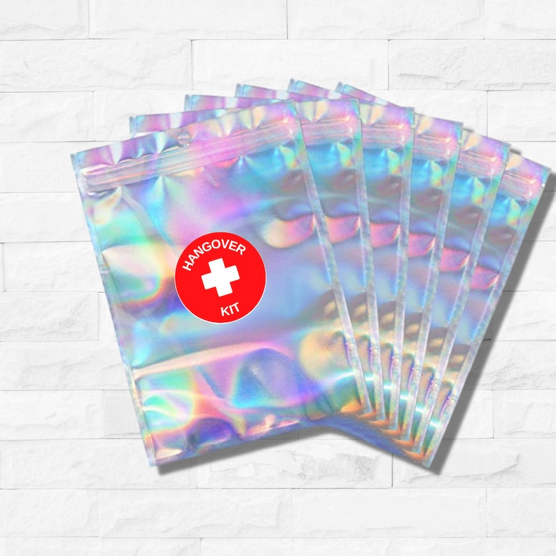 Holographic zip lock bag with red and white hangover kit sticker on the front.