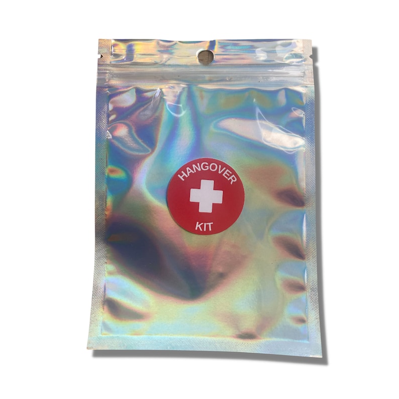 Holographic zip lock bag with red and white hangover kit sticker on the front.