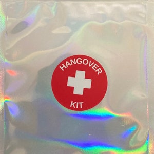 Holographic zip lock bag with red and white hangover kit sticker on the front.