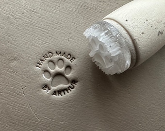 Personalized first name and dog paw pottery stamp. Dog paw ceramic stamp. Customizable ceramic pottery stamp.