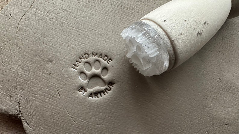 Personalized first name and dog paw pottery stamp. Dog paw ceramic stamp. Customizable ceramic pottery stamp. image 1