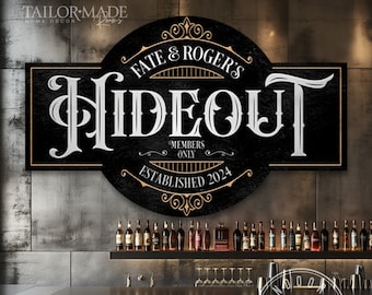 May include: Black and gold sign with the text "Fate & Roger's Hideout" in a vintage font. The sign also includes the text "Members Only" and "Established 2024".