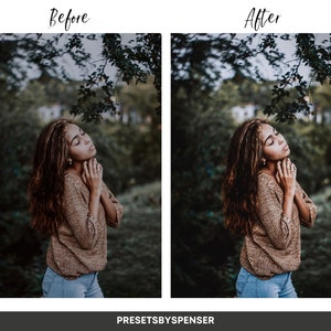 May include: A woman with long brown hair is standing in a woodland. She is wearing a brown jumper and blue jeans. The trees are green and the light is soft.