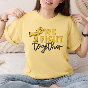 Childhood cancer awareness tshirt, in September we wear gold, fight childhood cancer gold ribbon tee, we fight cancer together shirt