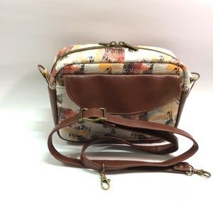 Faux Leather Crossbody: Fall colors, exterior slip pocket with flap, back zipper pocket, top zipper closure, bronze hardware, fully lined