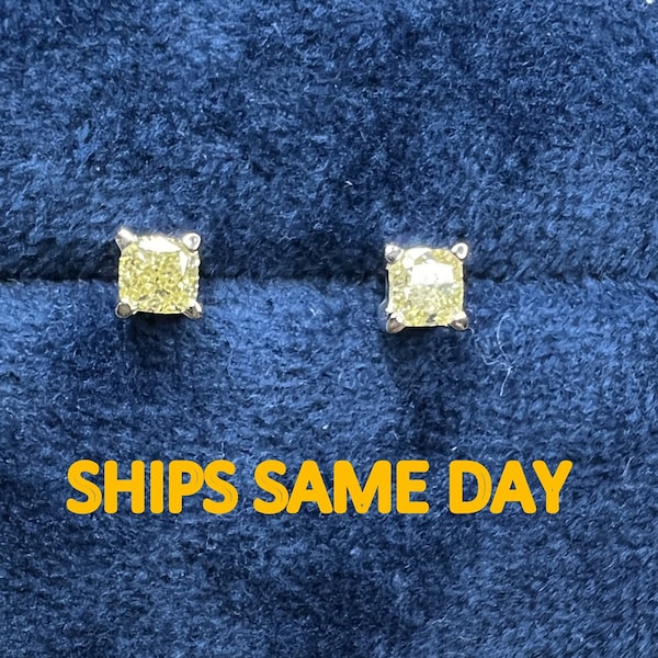 Genuine natural fancy yellow diamond cushion cut gold earrings. SI-VS quality 0.5-1 carat total weight earring studs. Yellow diamond studs.