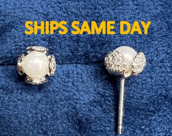 Freshwater pearl and diamond earrings in silver and gold plated silver. 5 mm pearl wrapped in diamond studded petals. Bridesmaid gift.