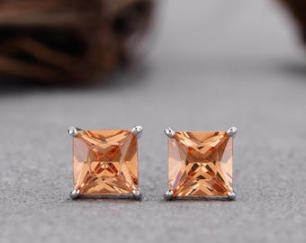 Man made Orange diamond Studs in Sterling Silver. 2.1 carat total weight. unisex earring studs. Round, Princess and heart shaped earrings.