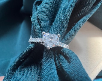 0.76 carat total weight natural diamond engagement ring with 0.51 ct heart cut center diamond and brilliant cut round diamond studded band.