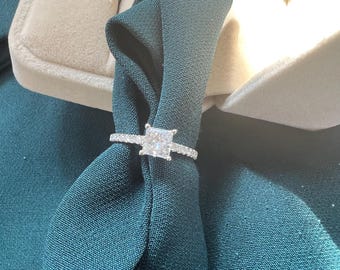 1.02 carat princess cut diamond solitaire ring. 1.27 ct total weight natural diamond engagement ring in 18kt white gold with round diamonds.