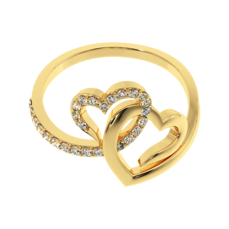 May include: A gold ring with two interlocking heart designs, each heart is outlined with small clear stones.