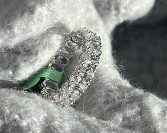 5 carat oval cut lab grown diamond eternity band in white gold. Diamond engagement band for her. Perfect wedding or anniversary gift.
