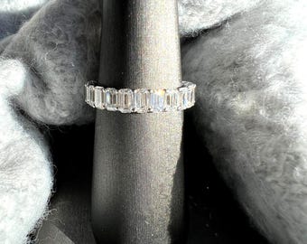 4 carat plus emerald cut diamond eternity band. White gold diamond wedding band. Luxury diamond wedding band. Emerald cut lab grown diamonds