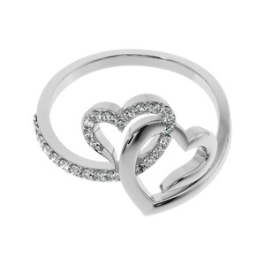 May include: A silver ring with two interlocking heart designs, each heart is accented with small clear stones.