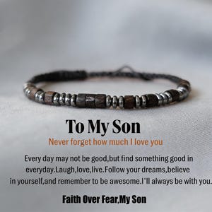 May include: A bracelet featuring alternating dark brown wooden beads and metallic silver-toned beads on a dark cord. Below the bracelet, text reads: To My Son, Never forget how much I love you, Every day may not be good, but find something good in everyday. Laugh, love, live. Follow your dreams, believe in yourself, and remember to be awesome. I'll always be with you. Faith Over Fear, My Son.