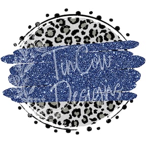May include: A blue glitter background with a white floral design and the text "Tin Cow Designs" in a white font. The background is surrounded by a circle of black and white leopard print.