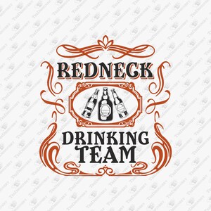 May include: A graphic design featuring the text REDNECK DRINKING TEAM in black, bold, serif lettering. The design includes an illustration of three glass bottles centred within an ornate, rust-coloured frame with decorative scrollwork accents.