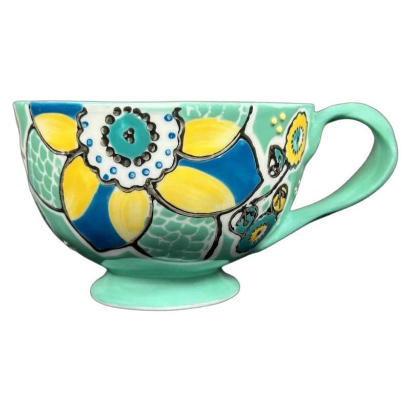 Anthropologie Elka Ayaka green floral pedestal mug handpainted ceramic cup with yellow and blue flowers