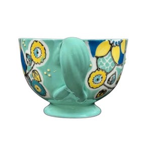 Anthropologie Elka Ayaka green floral pedestal mug ceramic turquoise mug with yellow blue floral pattern and gold dots