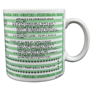May include: White ceramic mug with a green and white striped design. The mug features text in green, including programming-related terms like ALGOL, APL, and BASIC, along with humorous quotes about computers. A perfect gift for a programmer or computer enthusiast.