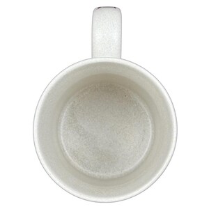 Interior view of a Disneyland Minnie Mouse VIP vintage mug in white with a textured finish