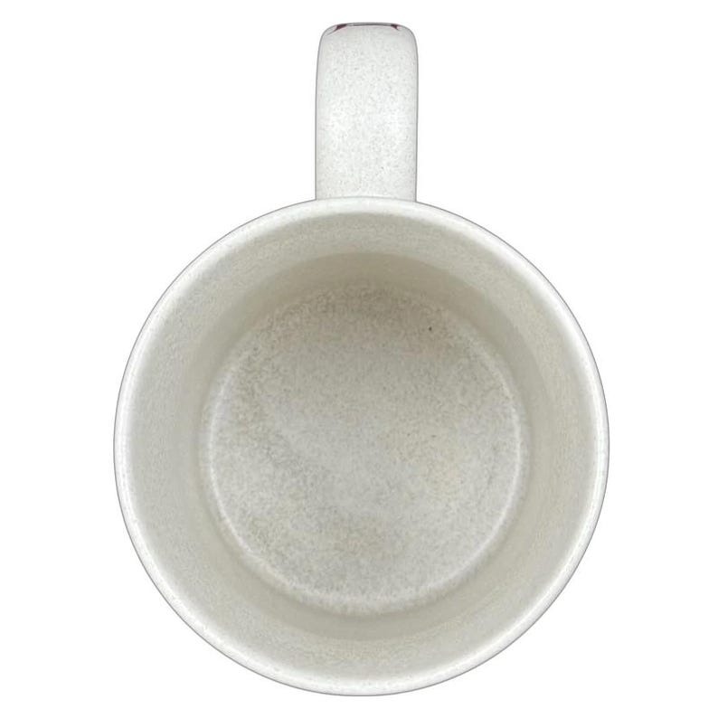 Interior view of a Disneyland Minnie Mouse VIP vintage mug in white with a textured finish