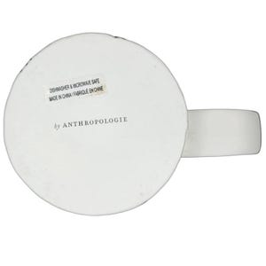 Bottom view of Dagny Letter 'N' Monogram Mug Anthropologie, featuring dishwasher and microwave safe label