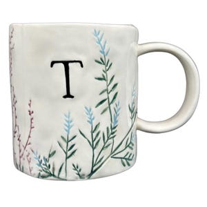 Anthropologie Dagny T monogram initial mug with elegant botanical designs and a unique shape