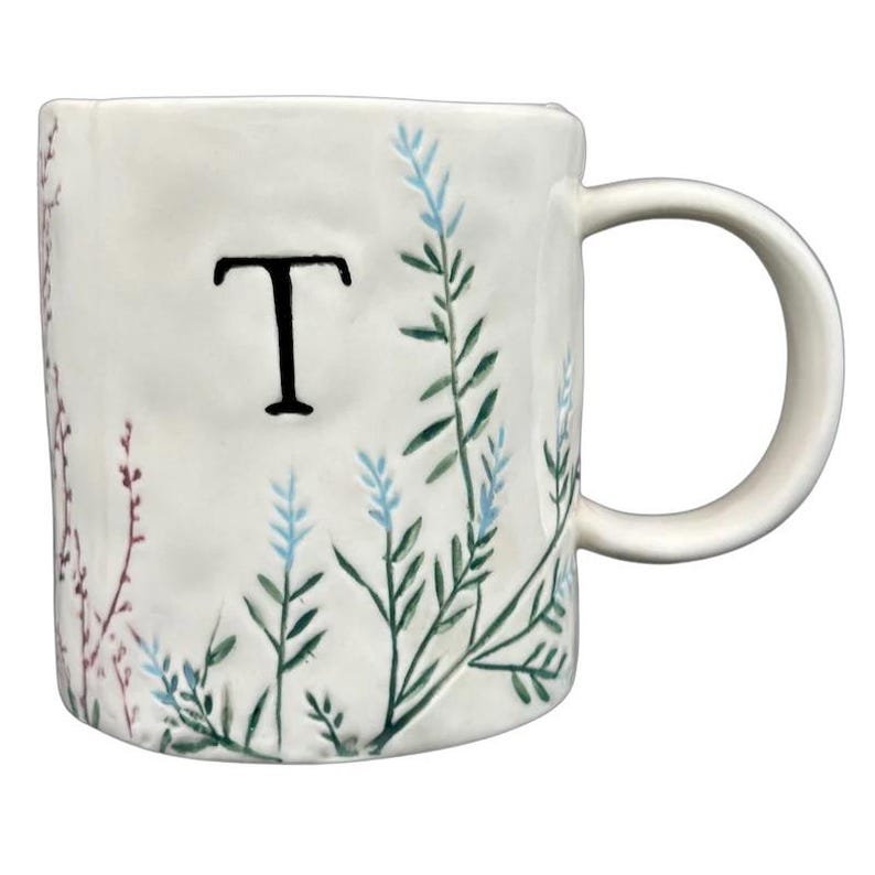 Anthropologie Dagny T monogram initial mug with elegant botanical designs and a unique shape