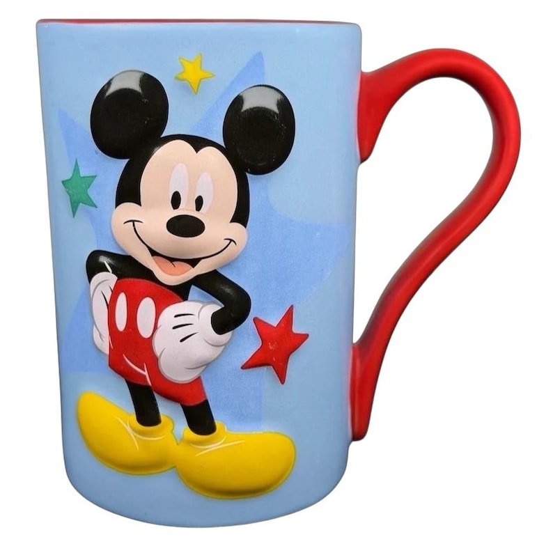 Mickey Mouse embossed stars Disney mug featuring colorful design and playful Mickey character