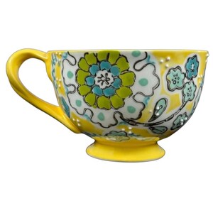 Anthropologie Elka Ayaka floral pedestal mug yellow ceramic cup with green blue floral pattern and handle