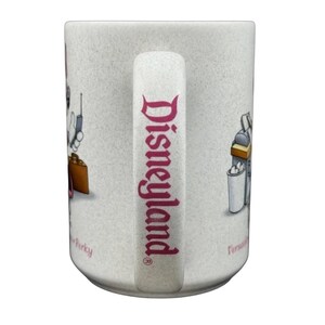 Disneyland Minnie Mouse VIP vintage mug featuring iconic characters and festive design