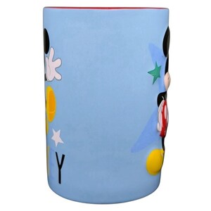 Mickey Mouse embossed stars Disney mug featuring colorful designs and a smooth surface