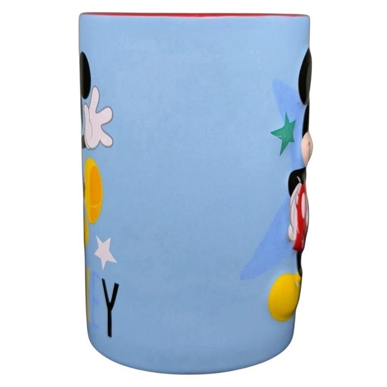 Mickey Mouse embossed stars Disney mug featuring colorful designs and a smooth surface