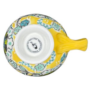 Anthropologie Elka Ayaka floral pedestal mug top view yellow ceramic mug with turquoise floral pattern and pedestal base