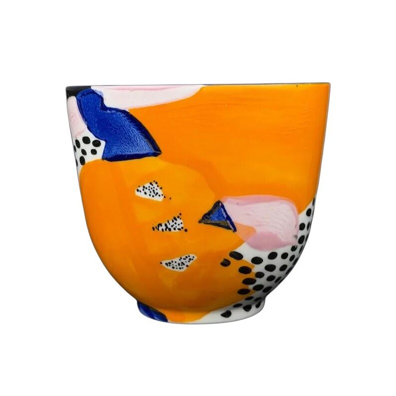 Colorful Cassie Byrnes Anthropologie Mug with Abstract Patterns and Vibrant Orange Background