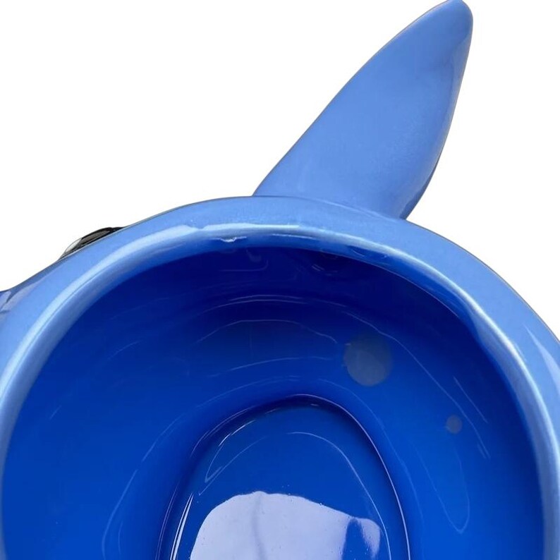 Inside view of Stitch 3D Collectible Shaped Mug Disney featuring vibrant blue color and unique design.