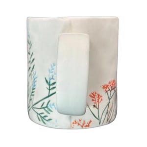 Anthropologie Dagny T monogram initial mug with floral design and unique handle