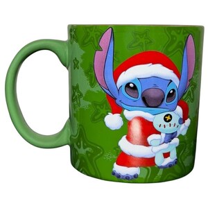 Disney Stitch Santa holiday collectible mug featuring Stitch in a Santa outfit holding a small character