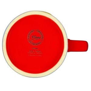 Red bottom view of a Mickey Mouse embossed stars Disney mug showcasing the Disney brand logo
