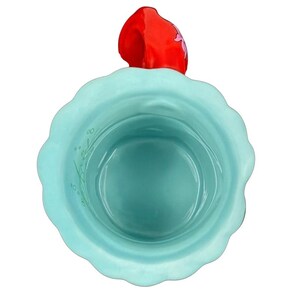 Top view of ceramic turquoise scalloped mug with red Ariel handle Ariel The Little Mermaid Disney Parks vintage mug