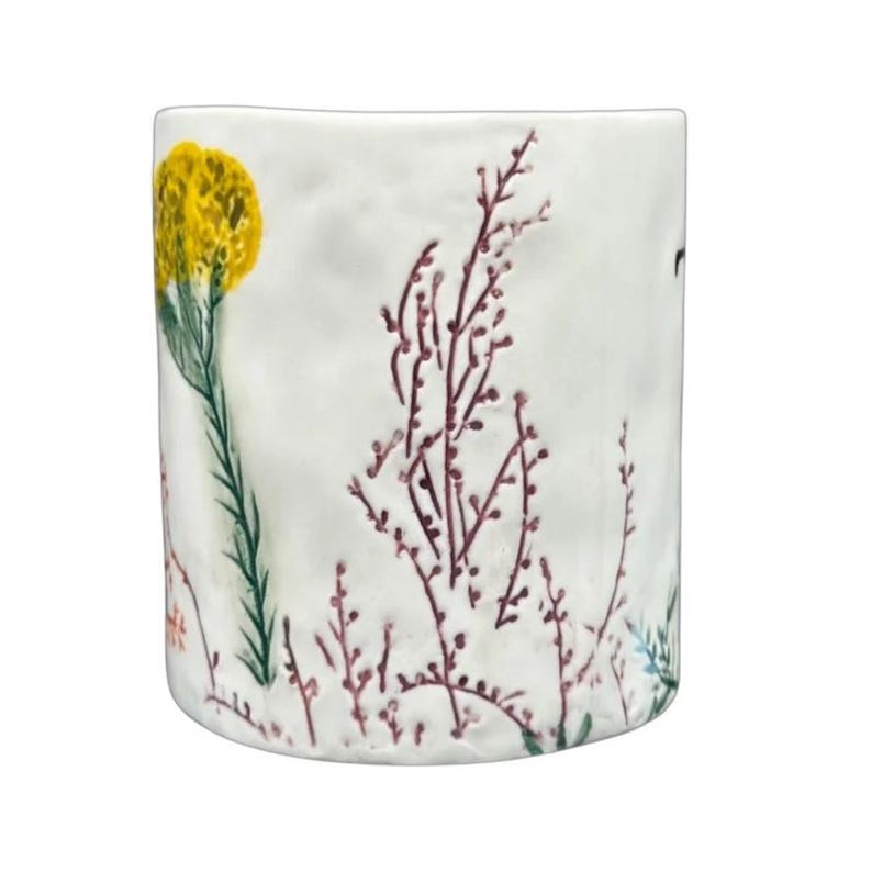 Anthropologie Dagny T monogram initial mug with delicate floral design in yellow and purple hues