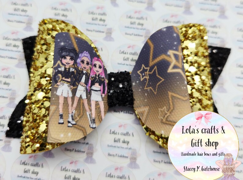 May include: A white ceramic mug with a black handle and the text "But First, Coffee" in a bold, black font. The mug is set against a blurred background, suggesting a cozy setting.