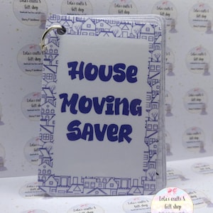 May include: A clear House Moving Saver booklet with a metal ring. The cover displays the text "HOUSE MOVING SAVER" in blue, framed by a blue house border design. The background has a repeating pattern of small houses.