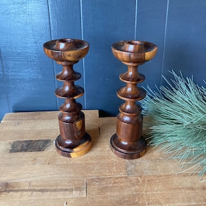 Pair of wooden spindle candlestick holders
