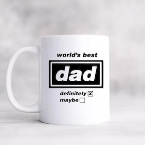 May include: White ceramic mug with the text "world's best dad" in black. The word "dad" is in a black rectangle. Below, the text reads "definitely" with a checked box and "maybe" with an unchecked box. A perfect gift for Father's Day.