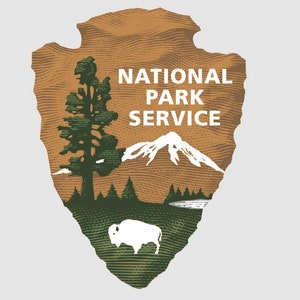 May include: A brown and green National Park Service arrowhead logo with a white mountain range, a pine tree, and a white bison. The text "NATIONAL PARK SERVICE" is in white letters.