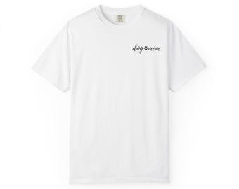 May include: White t-shirt with the text "dog mom" in a black script font, accompanied by a paw print. The shirt has a crew neck and short sleeves. The fabric appears to be a soft, comfortable material.